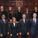 Supreme Court Chief Justice John G. Roberts, Jr. and a panel of judges 