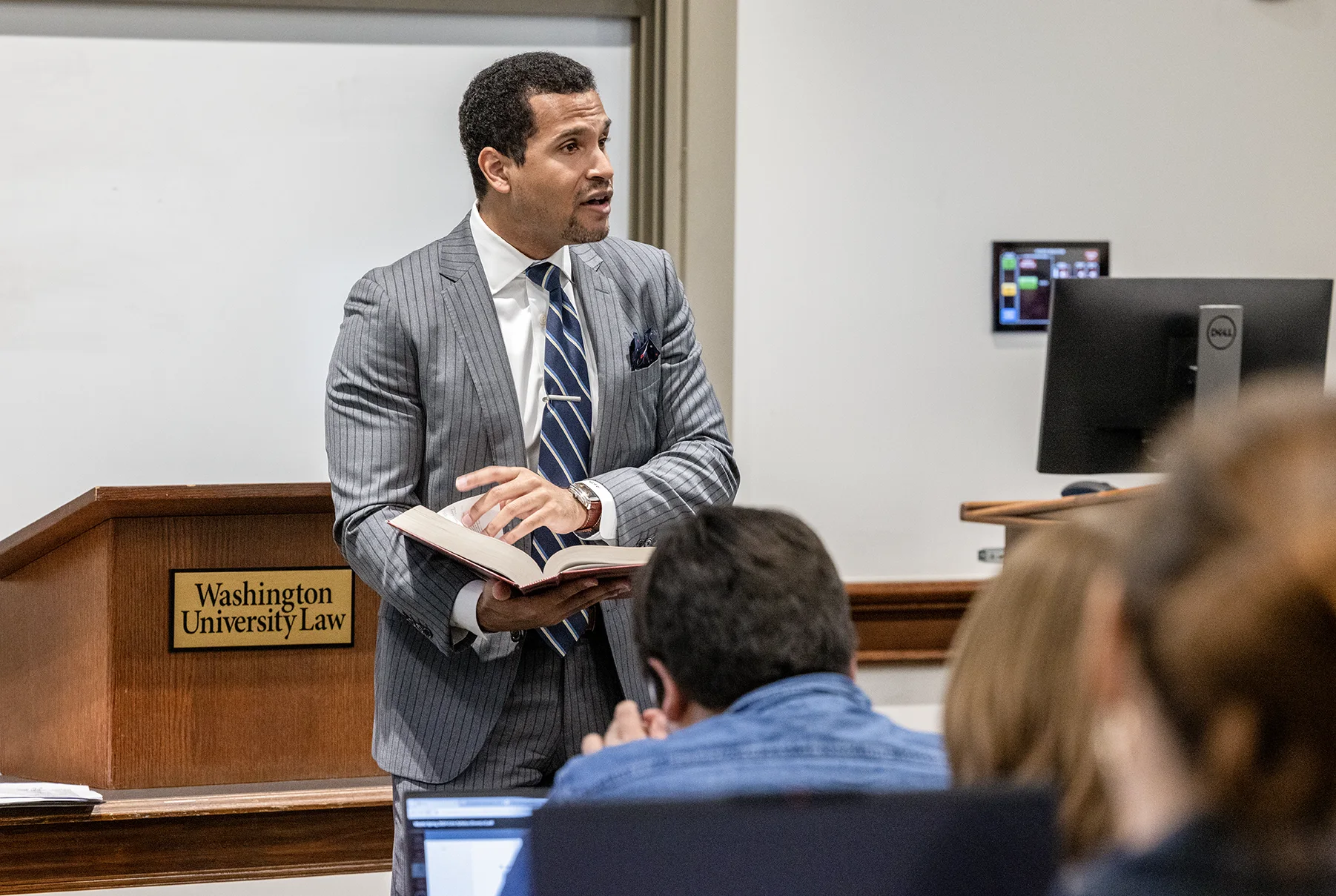 Professor lecturing a law class at WashU Law.