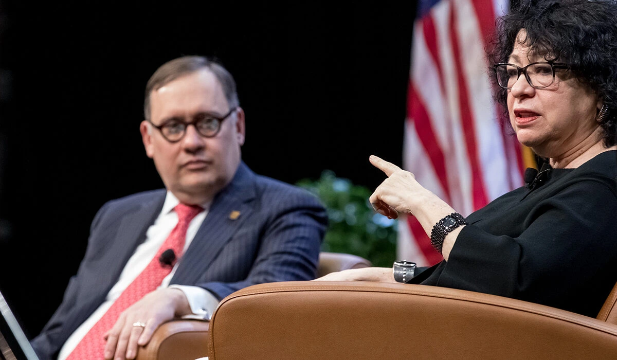 upreme Court Justice Sonia Sotomayor speaks to students, faculty and staff, as Chancellor Andrew D. Martin looks on