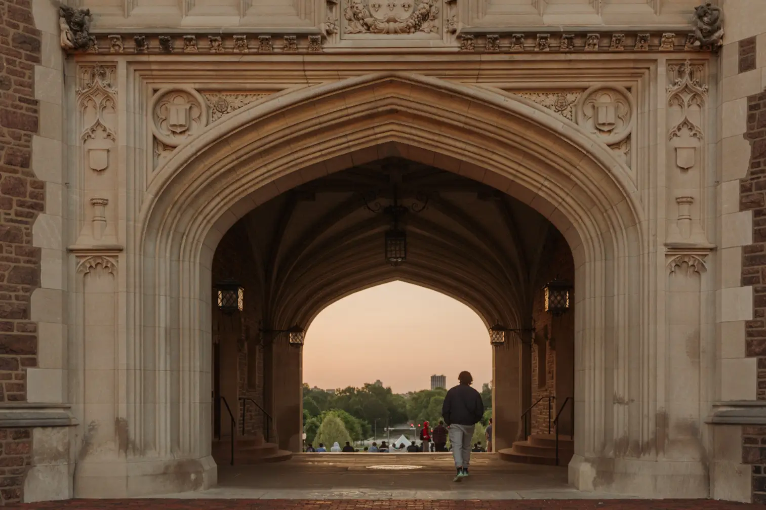 Student walking through WashU Law campus