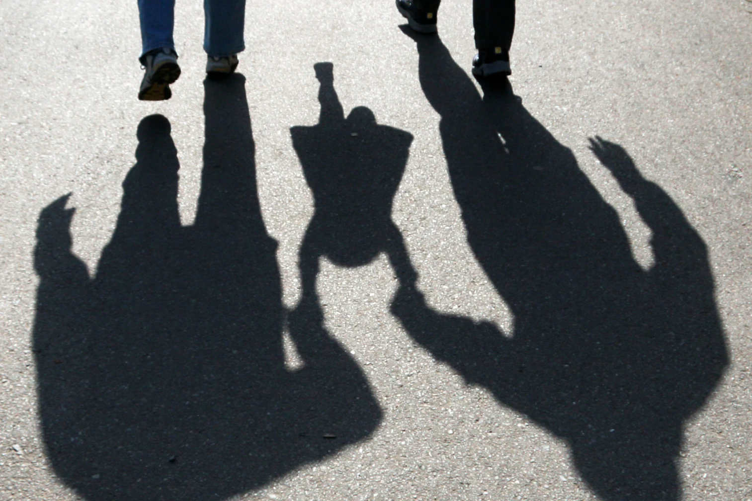 Shadow of a family walking