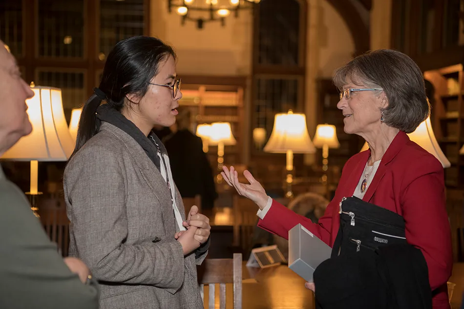 International student speaking with advisor.